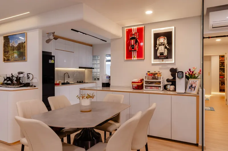 Dining table against the white kitchen